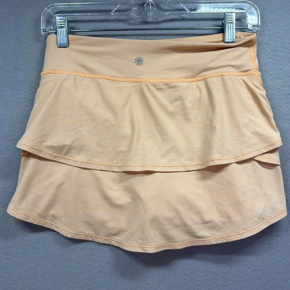Athleta Girl Swing Mini Skort XL/14 Light Peach Golf Tennis Performance Ruffled
